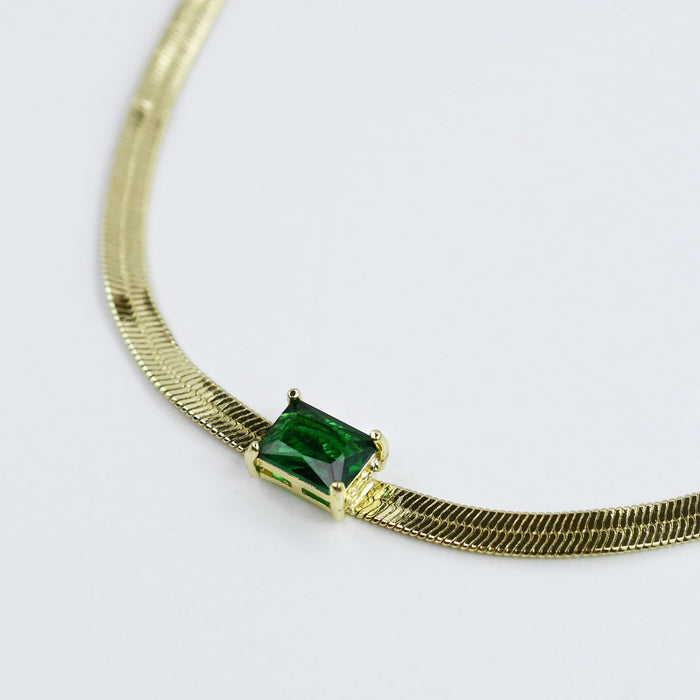 gold necklace with emerald green rectangular stone, wholesale jewelry for women's boutiques, statement accessory, boutique wholesale jewelry, waterproof necklaces, trendy design, hypoallergenic and tarnish free style