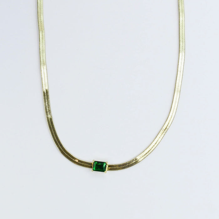 gold necklace with emerald green rectangular stone, wholesale jewelry for women's boutiques, statement accessory, boutique wholesale jewelry, waterproof necklaces, trendy design, hypoallergenic and tarnish free style