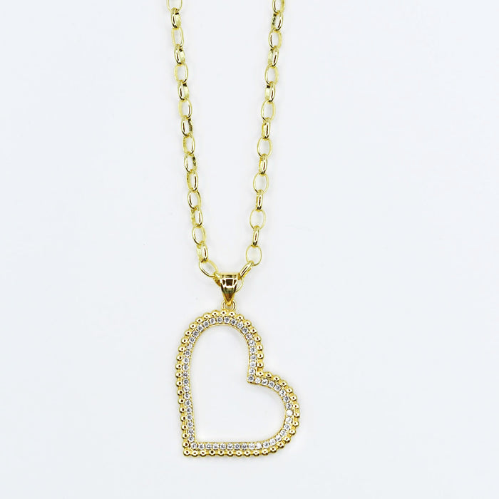 Dainty gold layered necklace, boutique wholesale jewelry, waterproof gold necklace, hypoallergenic and tarnish free statement accessory featuring a gold chain necklace with an open heart pendant adorned with small crystals