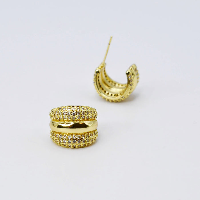 rounded gold huggies with dense micro pavé crystals, lustrous finish ideal for storefront displays, chic boutique accessory for retailers, hypoallergenic wholesale earrings for fashion shops, waterproof tarnish free jewelry detail for curated inventory